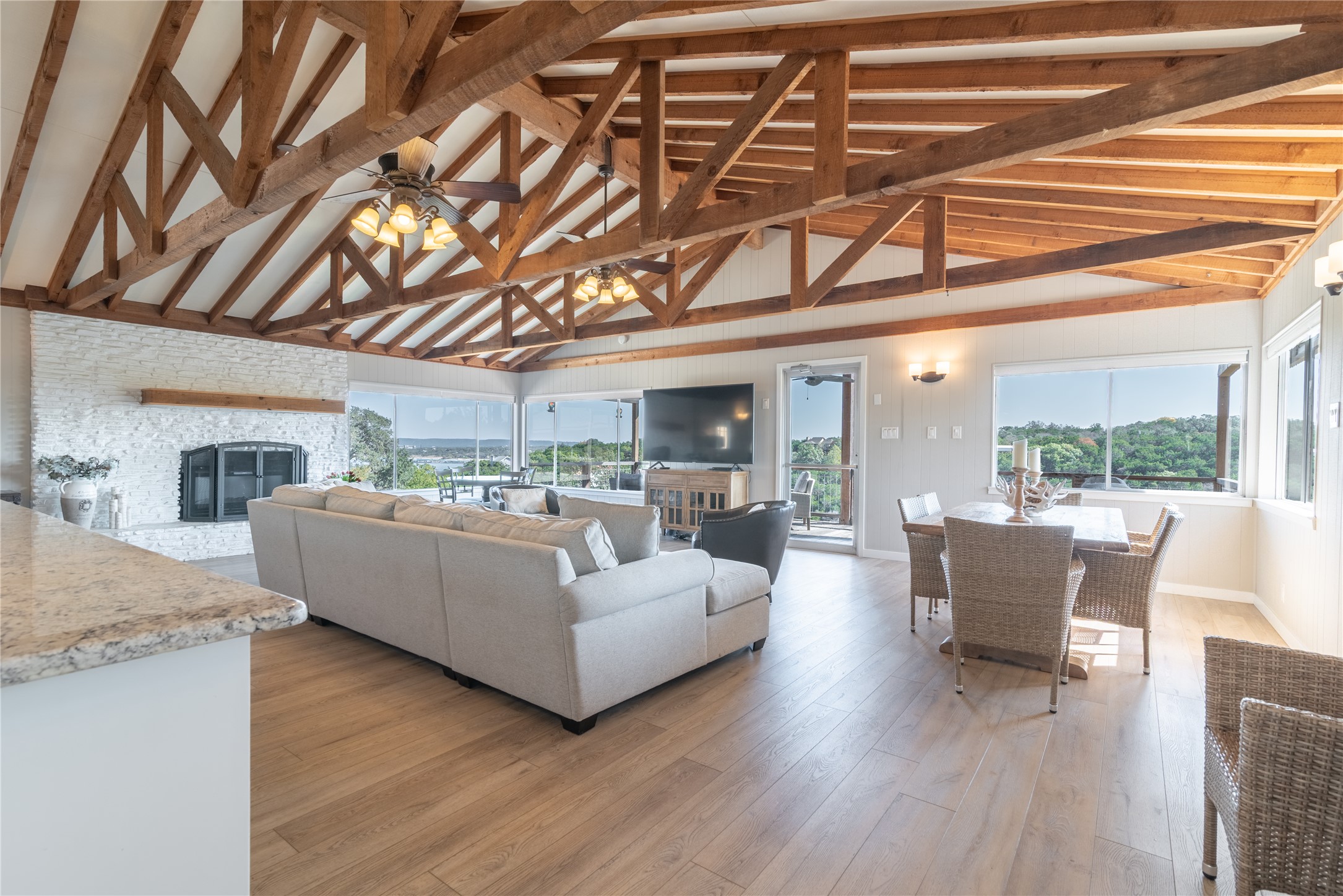 3807 Boat Dock Road Lago Vista, TX 78645 - Photo 8 of 37 Exposed beams complement the open-concept living and dining areas, all enjoying spectacular natural views through ample windows.