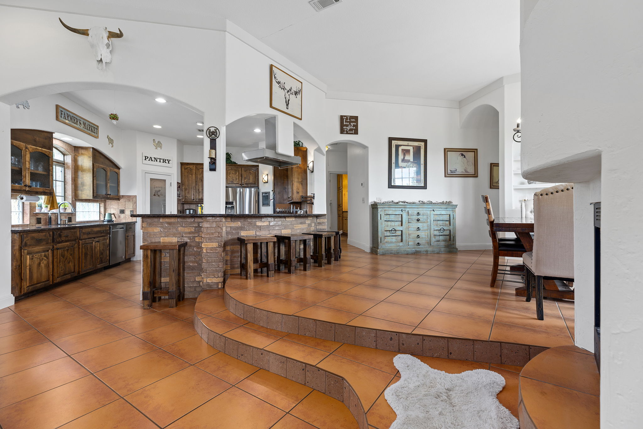 17308 St Therese Road Manor, TX 78653 - Photo 13 of 40 a view of a lobby with furniture and kitchen view