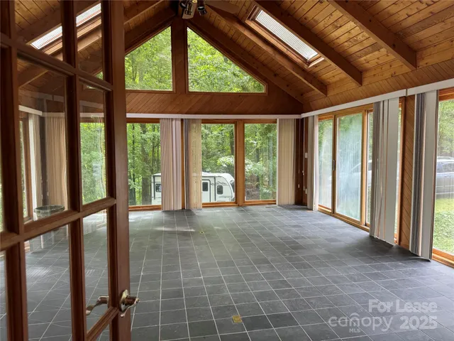 a view of an empty room with a balcony