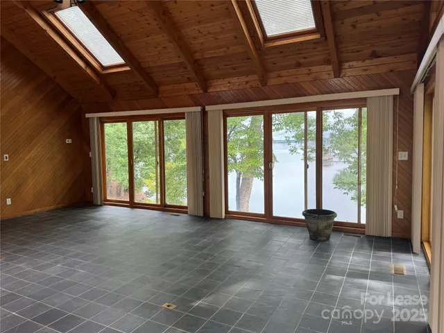 a view of an empty room with a balcony