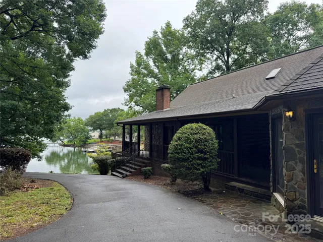 a view of a house next to a yard