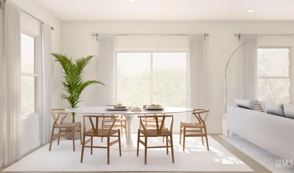 a view of a dining room with furniture window and outside view
