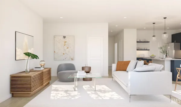 a living room with furniture and a lamp