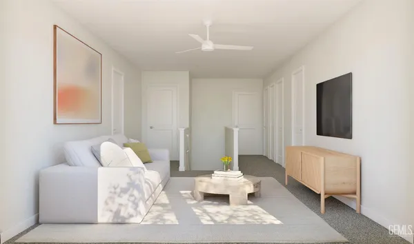 a living room with furniture and a potted plant