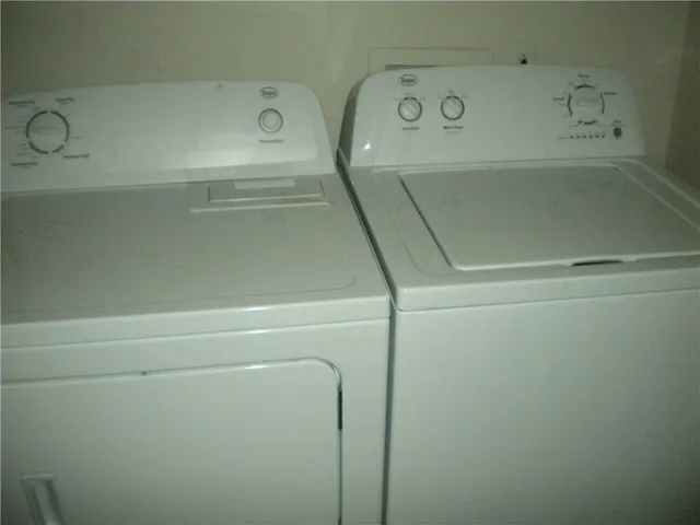 a kitchen with a sink and a refrigerator