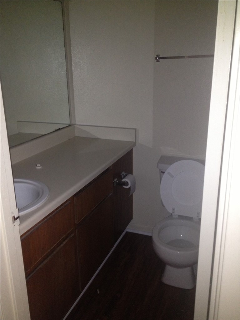 1110 Spring Loop, Unit D College Station, TX 77840 - Photo 6 of 9 a bathroom with a toilet and a sink