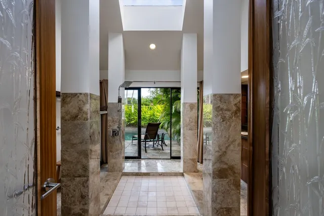 a bathroom with a glass shower door