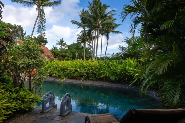 a view of a lake with a house in the background