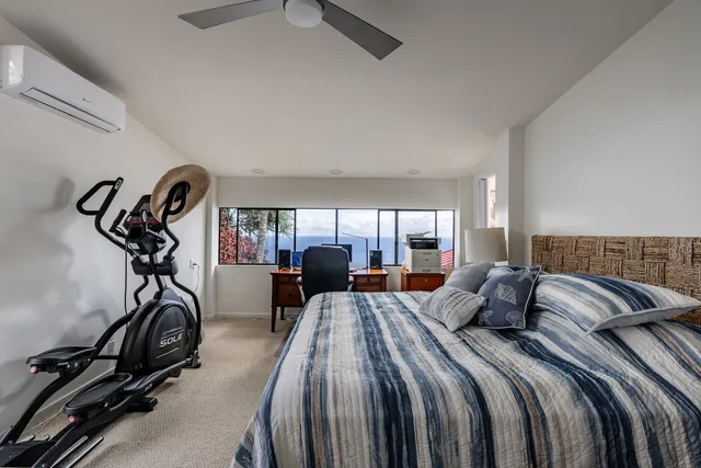 a view of a patio with table and chairs potted plants with floor to ceiling window and potted plants