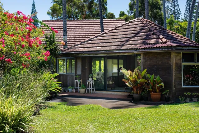 a dining room with furniture window and outside view