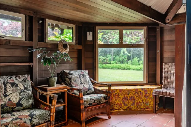 a bedroom with furniture and windows