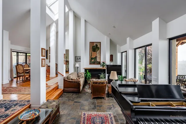 a living room with furniture and large window