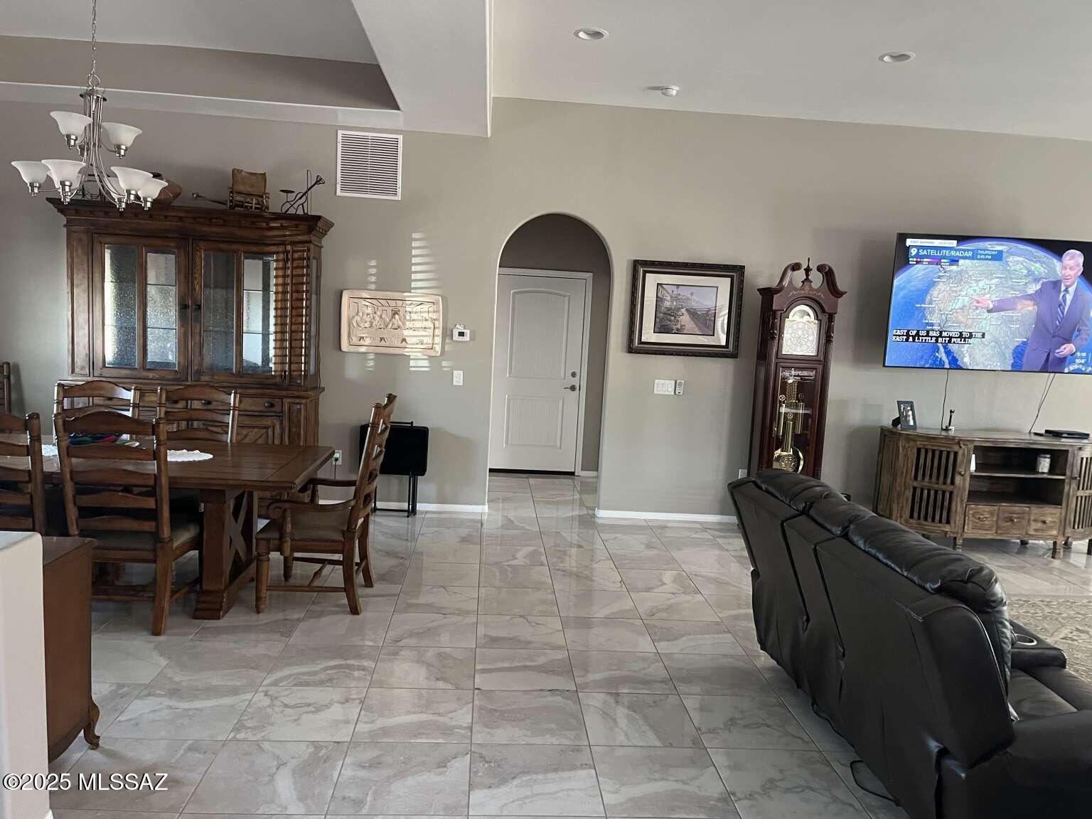 11553 East Tanque Verde Road Tucson, AZ 85749 - Photo 5 of 16 a living room with furniture and dining area