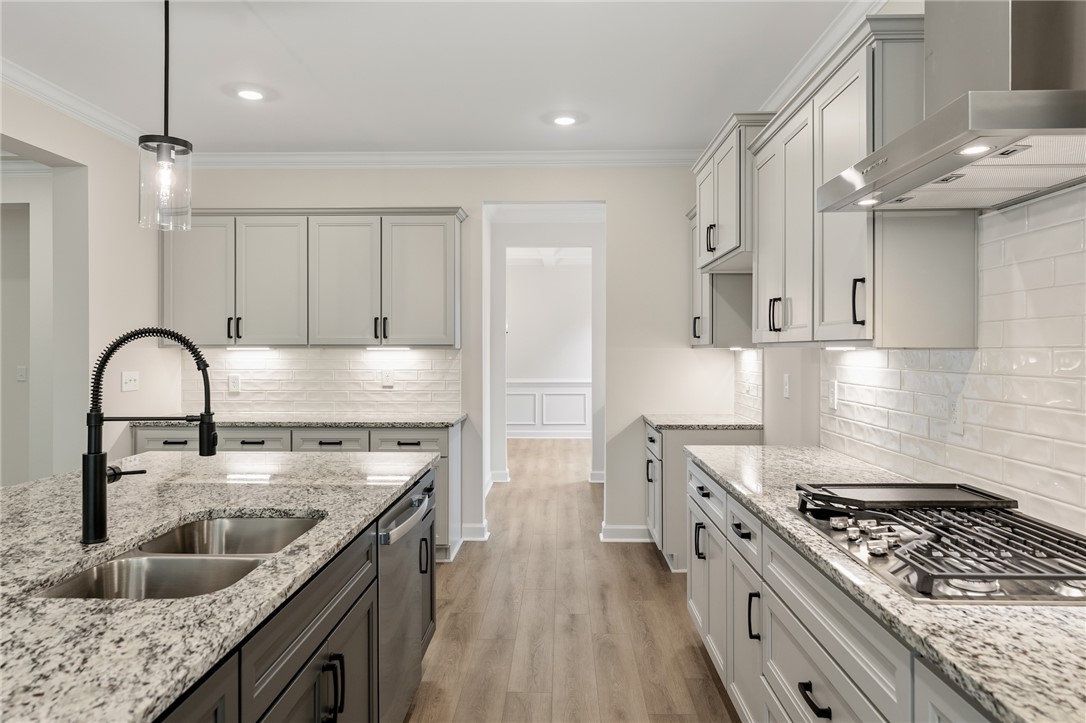 705 Weathered Oak Way Anderson, SC 29621 - Photo 11 of 47 This kitchen features a sleek design with ample counter space and modern appliances.