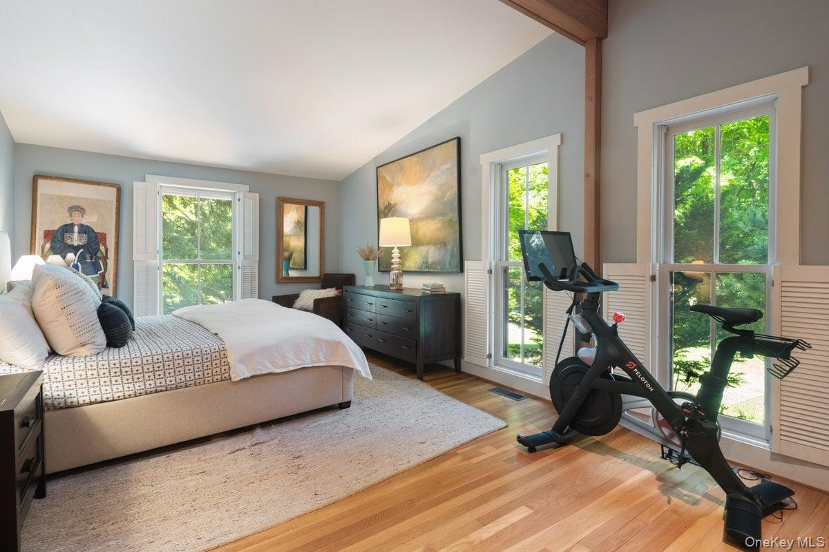 1821 Spring Valley Road Ossining, NY 10562 - Photo 29 of 48 Spacious and serene, the primary bedroom is anchored by oversized windows and highlighted by vaulted ceilings with natural wood beams. A true welcome escape.