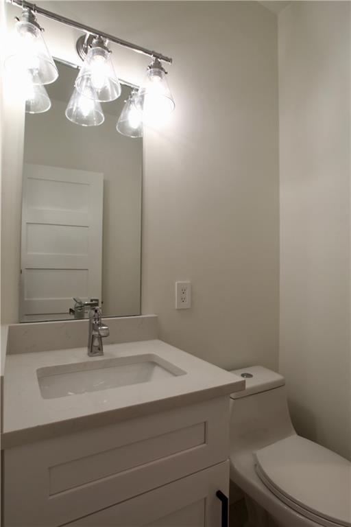 705 Harris Avenue, Unit A Austin, TX 78705 - Photo 14 of 33 a bathroom with a sink vanity and toilet