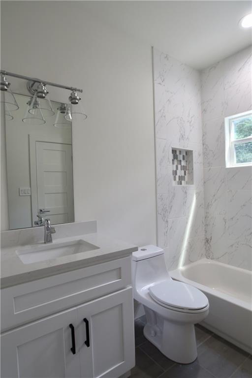 705 Harris Avenue, Unit A Austin, TX 78705 - Photo 24 of 33 a bathroom with a sink a toilet and a bathtub