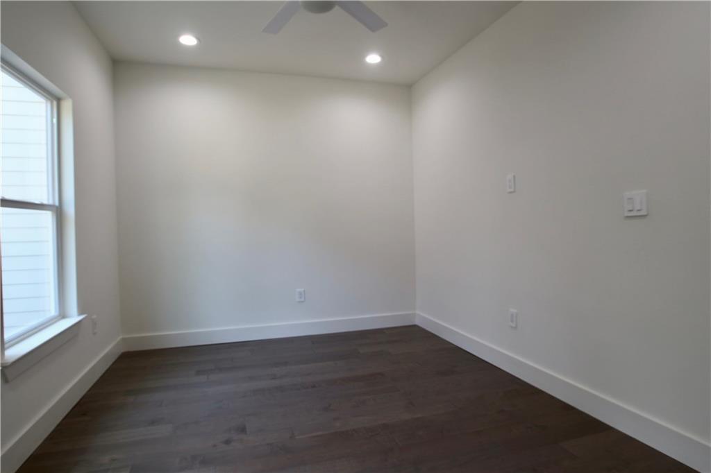 705 Harris Avenue, Unit A Austin, TX 78705 - Photo 26 of 33 wooden floor in an empty room with a window