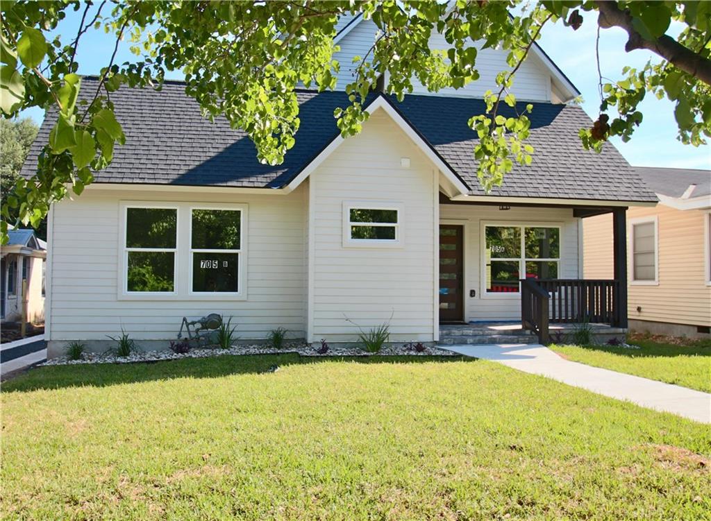 705 Harris Avenue, Unit A Austin, TX 78705 - Photo 32 of 33 a front view of a house with a yard
