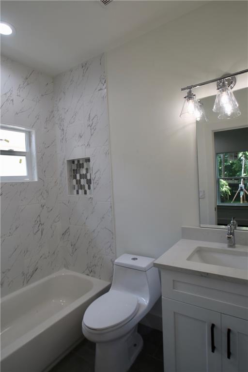 705 Harris Avenue, Unit A Austin, TX 78705 - Photo 9 of 33 a bathroom with a sink toilet and shower