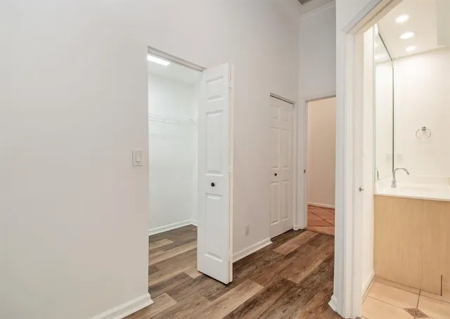 a view of a bathroom with wooden floor