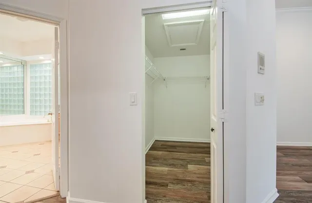 a bathroom with a sink a large mirror and a bathtub