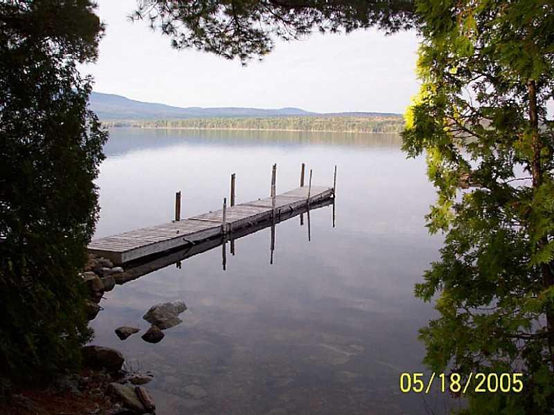 104 Birches Beach Road Oquossoc, ME 04964 - Photo 8 of 9 Exterior Front. Beautiful waterfront