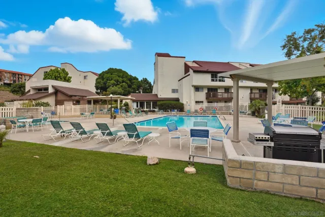 a view of a house with backyard porch and furniture