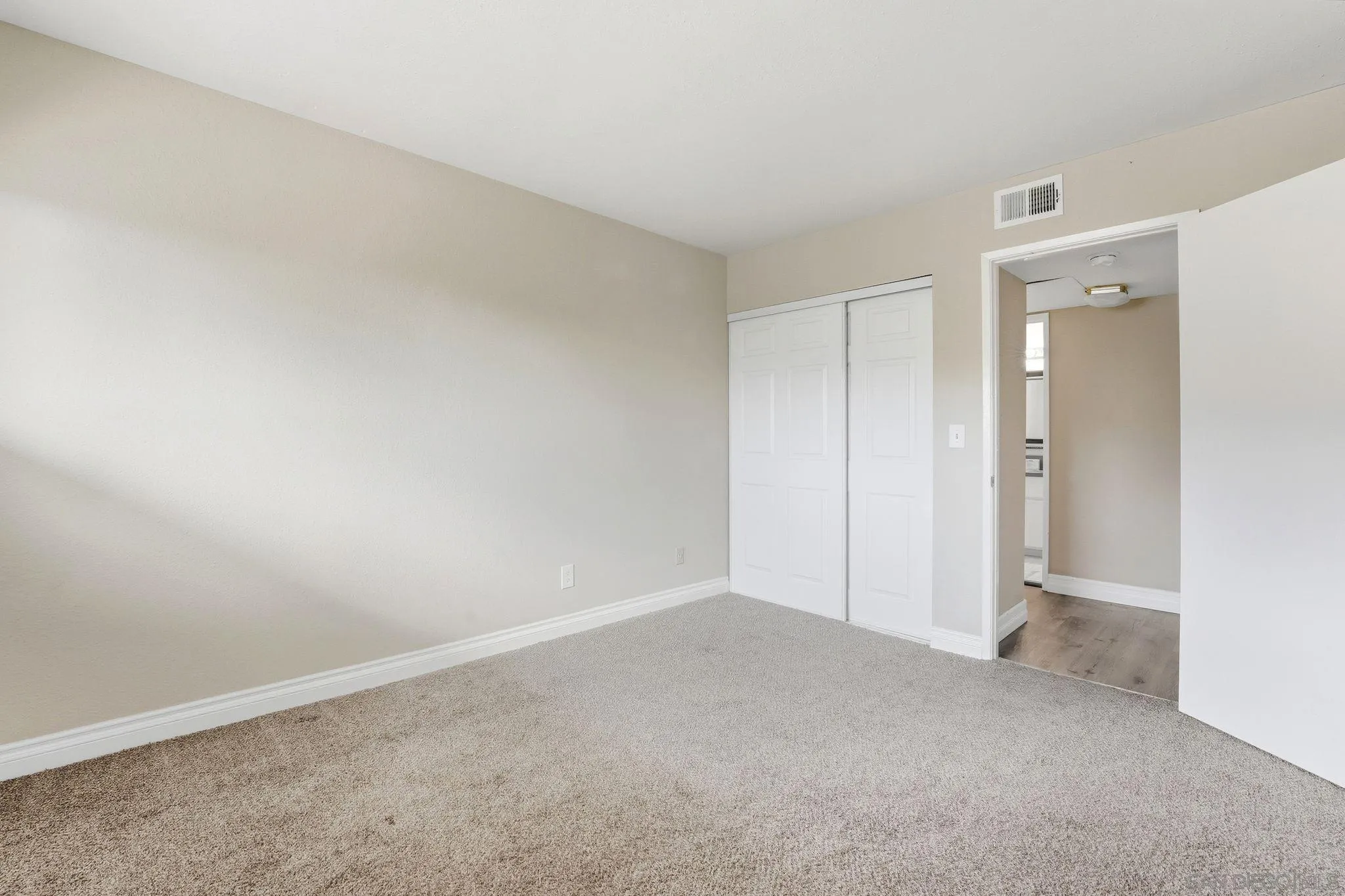 6111 Rancho Mission Road, Unit 209 San Diego, CA 92108 - Photo 15 of 20 a view of an empty room and closet area