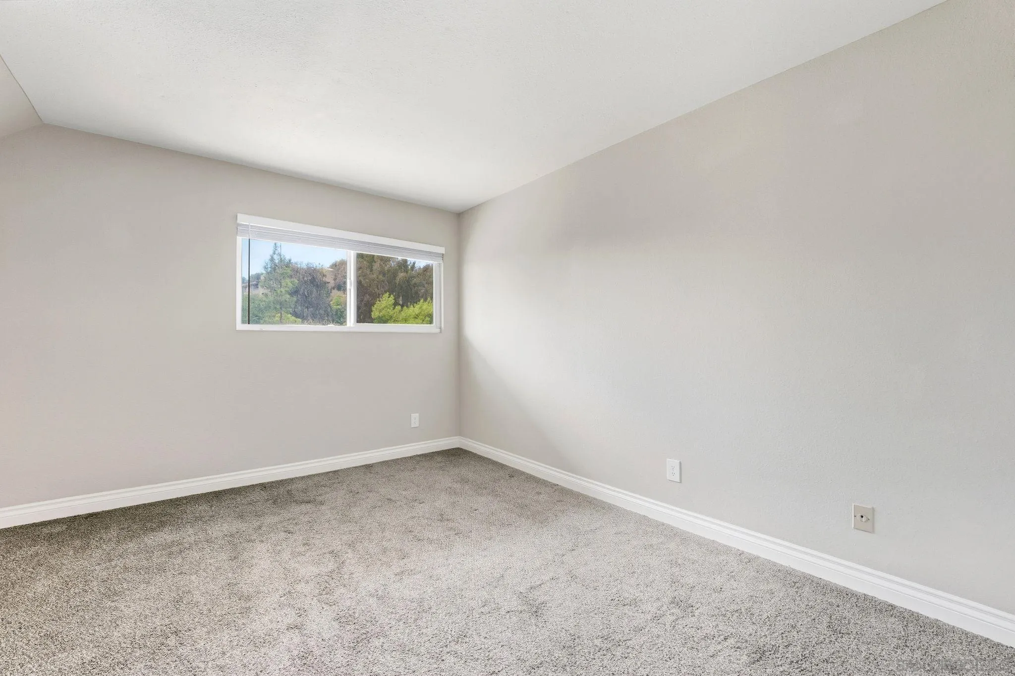 6111 Rancho Mission Road, Unit 209 San Diego, CA 92108 - Photo 16 of 20 an empty room with windows