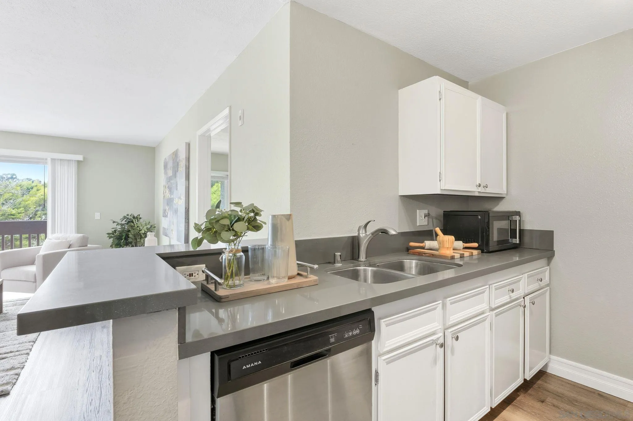6111 Rancho Mission Road, Unit 209 San Diego, CA 92108 - Photo 8 of 20 a kitchen with a sink and cabinets