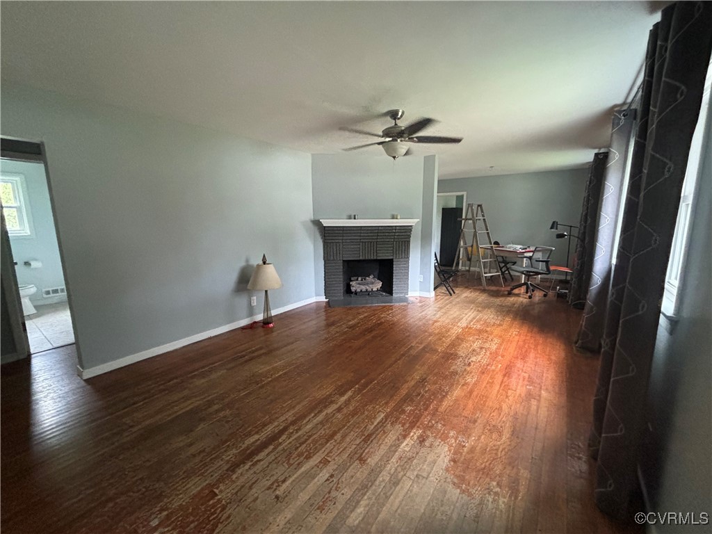 7414 Biscayne Road Henrico, VA 23294 - Photo 4 of 18 Unfurnished living room with ceiling fan, a firepl