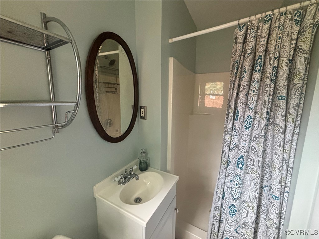 7414 Biscayne Road Henrico, VA 23294 - Photo 10 of 18 Bathroom featuring walk in shower and vanity