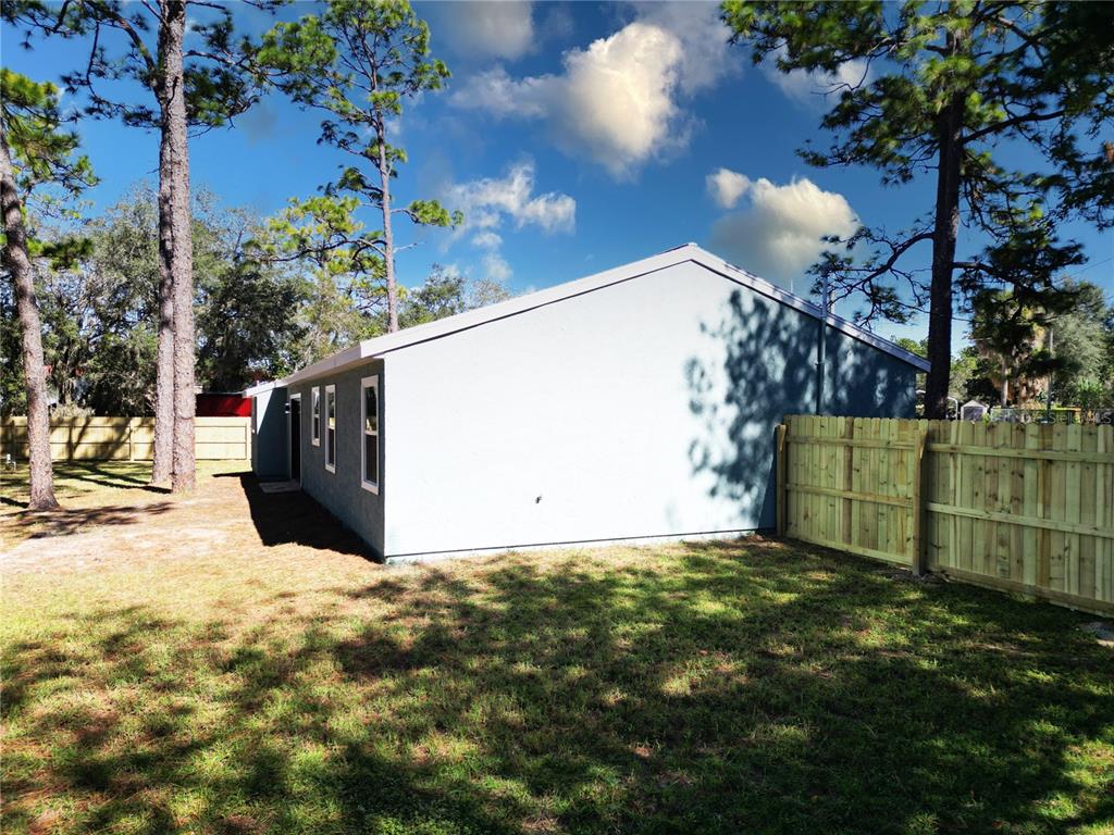 18 Midway Court Ocala, FL 34472 - Photo 12 of 38 a view of a back yard of the house