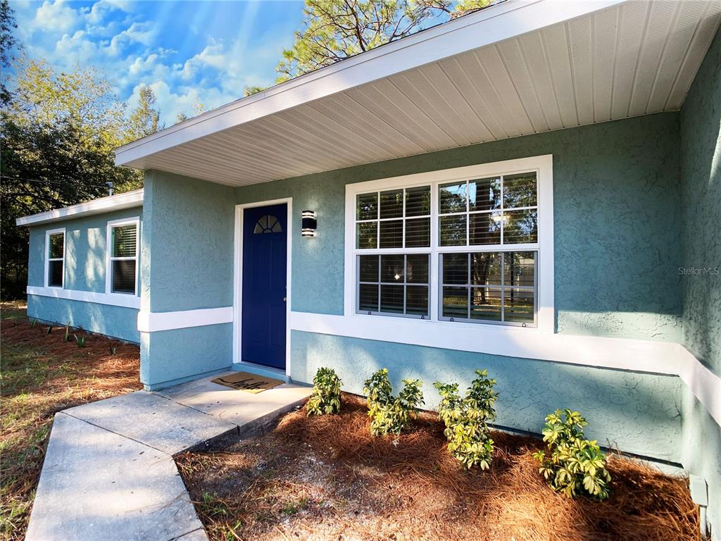 18 Midway Court Ocala, FL 34472 - Photo 15 of 38 a front view of a house with a yard