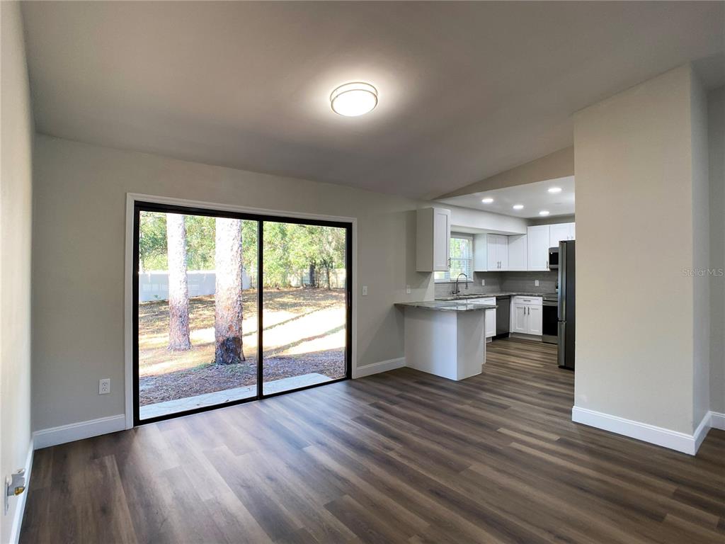 18 Midway Court Ocala, FL 34472 - Photo 20 of 38 a view of kitchen and wooden floor