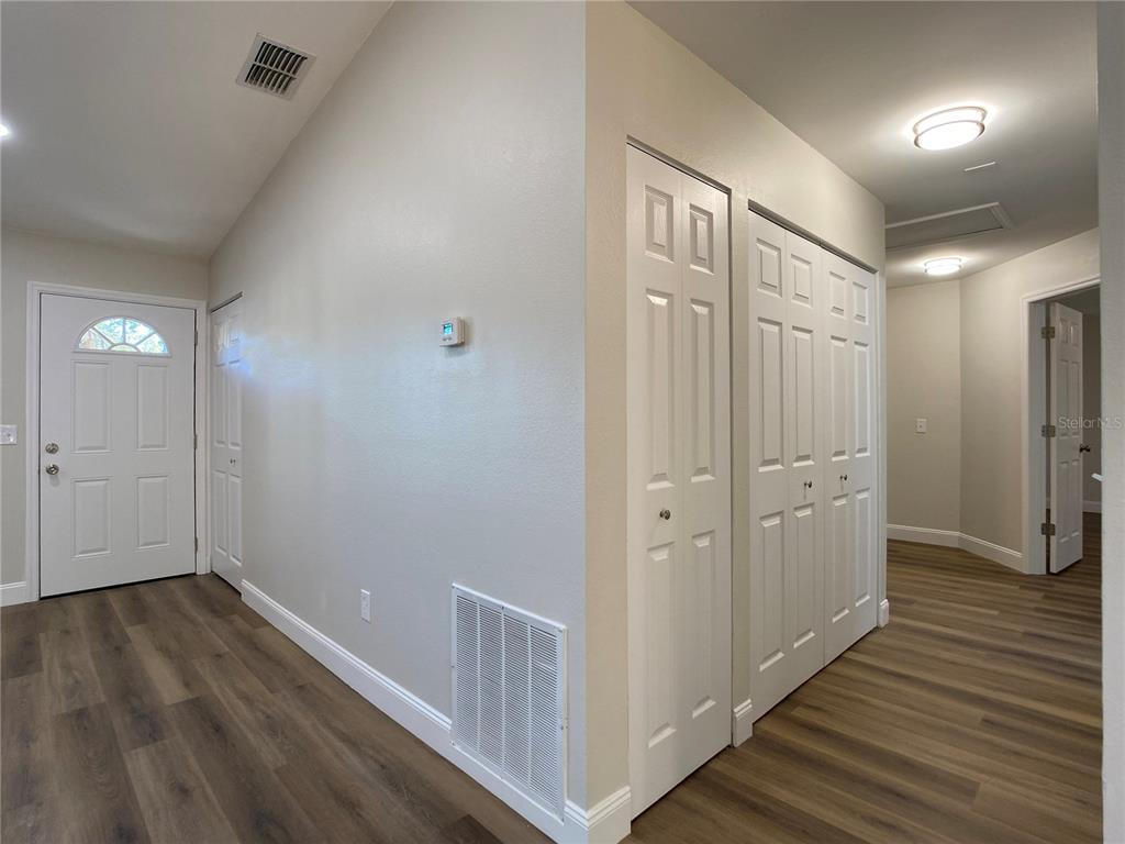 18 Midway Court Ocala, FL 34472 - Photo 26 of 38 a view of a hallway with wooden floor