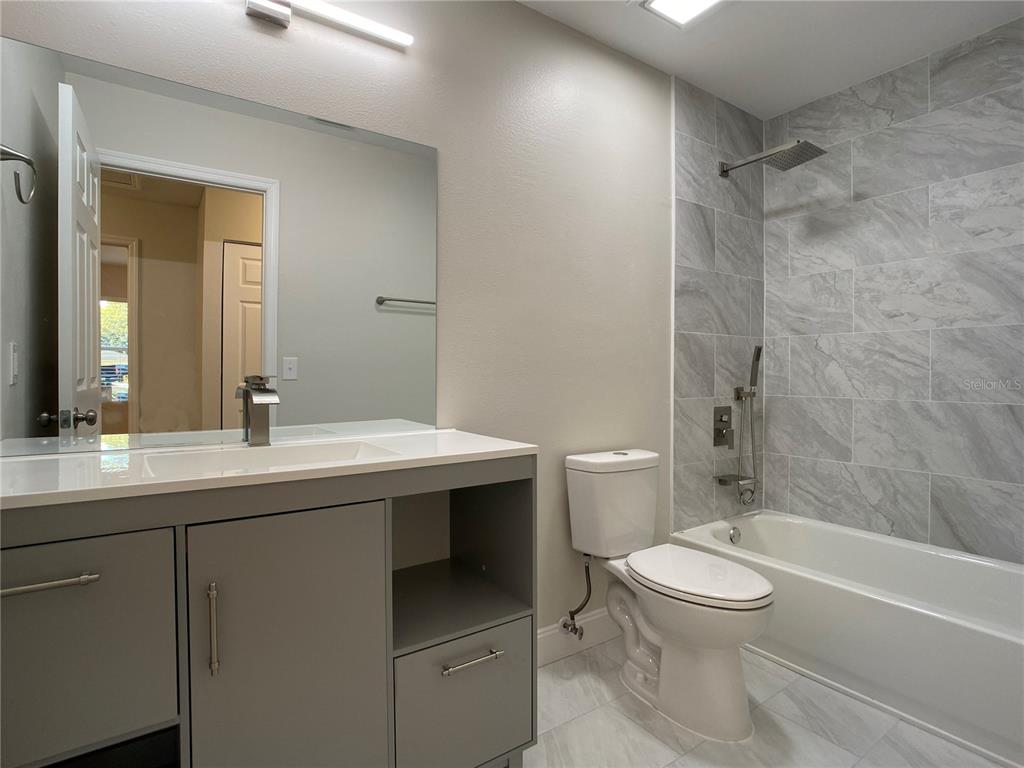 18 Midway Court Ocala, FL 34472 - Photo 28 of 38 a bathroom with a sink toilet vanity and shower