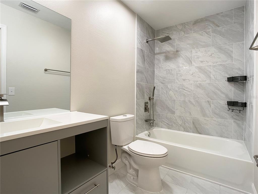 18 Midway Court Ocala, FL 34472 - Photo 29 of 38 a bathroom with a sink a toilet and a bathtub