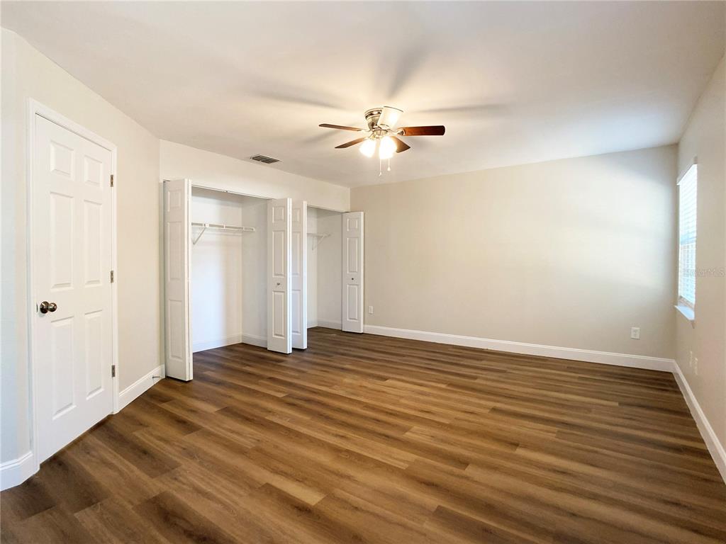 18 Midway Court Ocala, FL 34472 - Photo 30 of 38 a view of empty room with wooden floor and fan