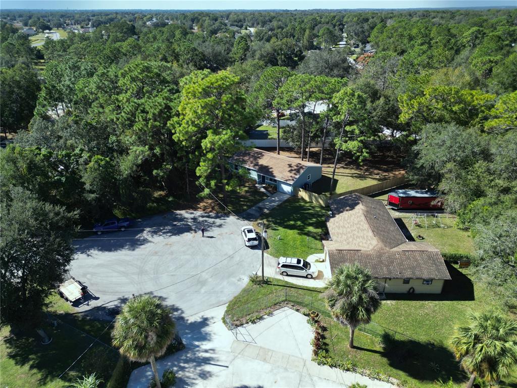18 Midway Court Ocala, FL 34472 - Photo 3 of 38 an aerial view of a house with yard