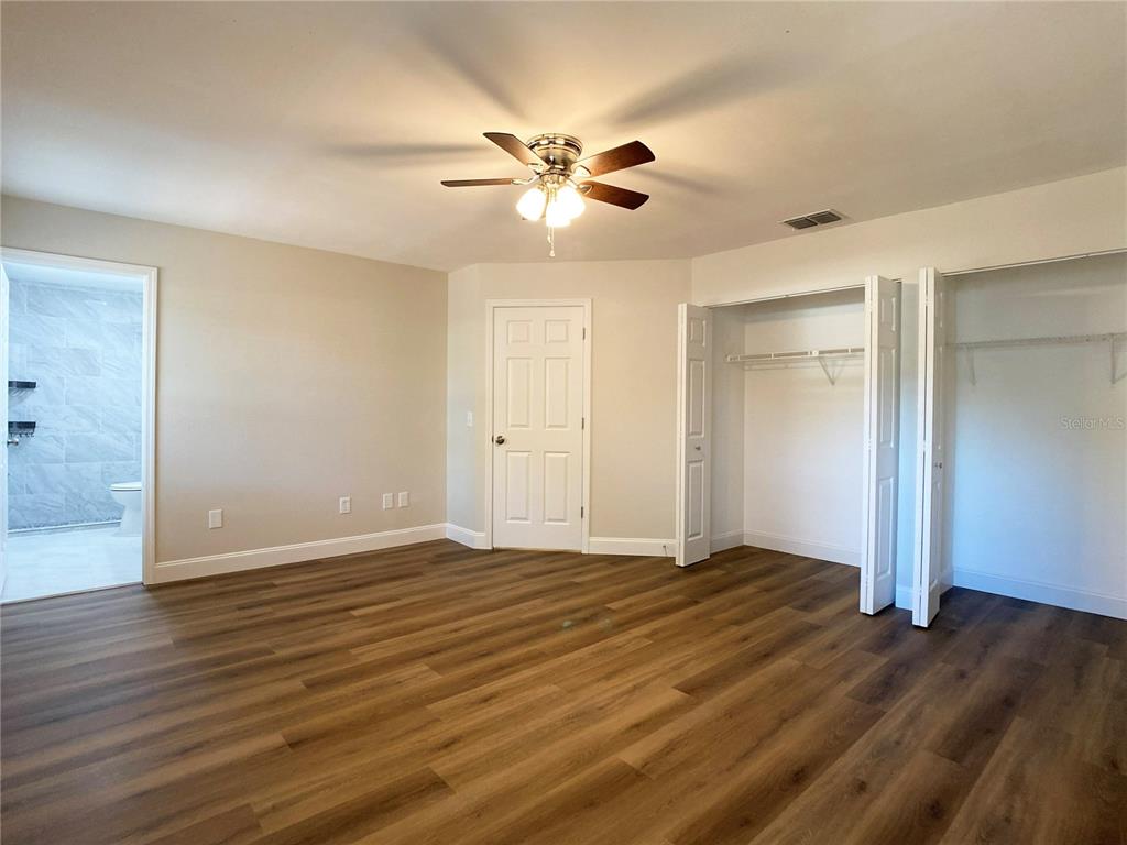 18 Midway Court Ocala, FL 34472 - Photo 31 of 38 a view of an empty room with wooden floor