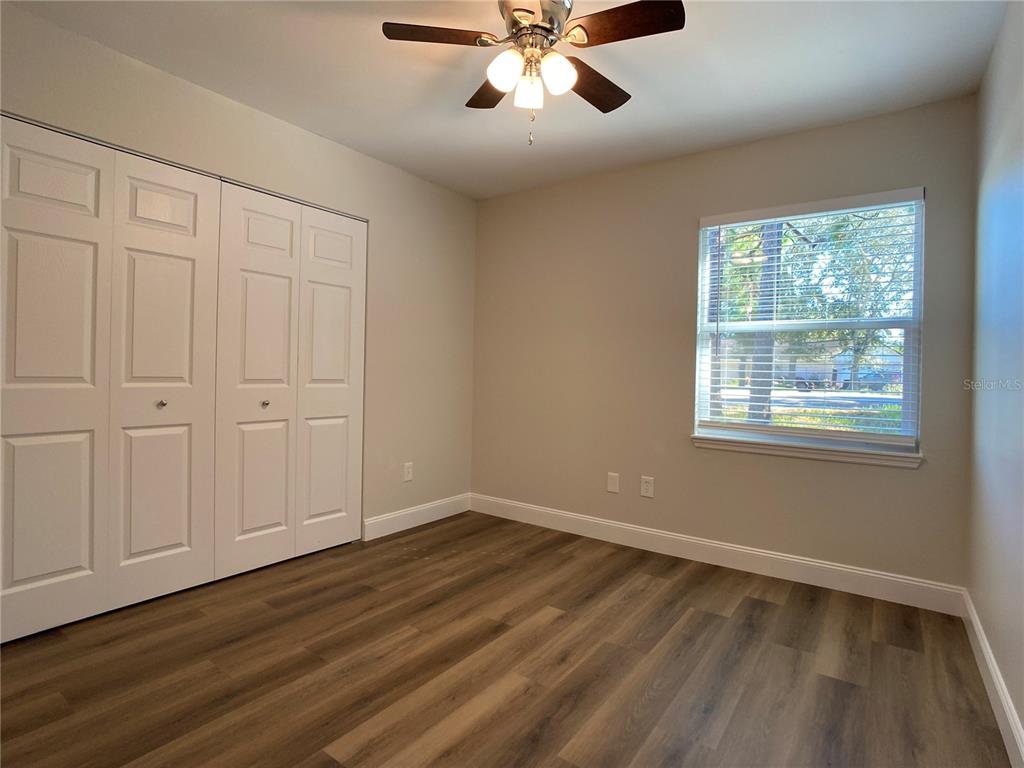 18 Midway Court Ocala, FL 34472 - Photo 37 of 38 a view of an empty room with wooden floor and a window