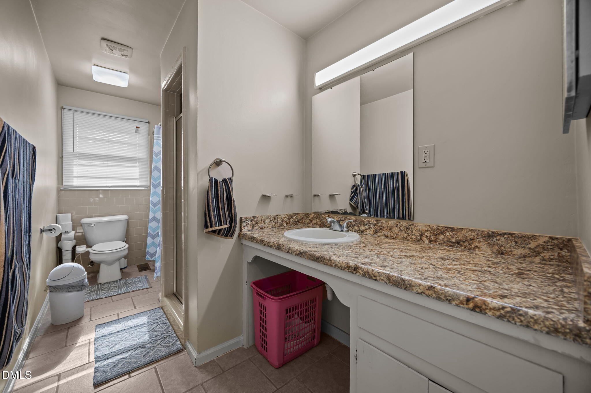 3256 North Old Franklin Road Spring Hope, NC 27882 - Photo 10 of 27 a bathroom with a granite countertop sink and a mirror