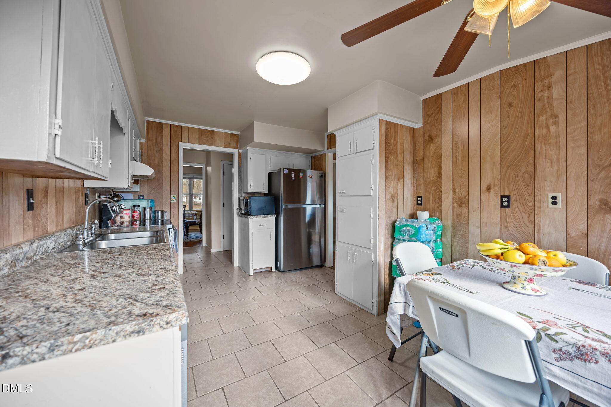3256 North Old Franklin Road Spring Hope, NC 27882 - Photo 7 of 27 a dining room filled with furniture and a refrigerator