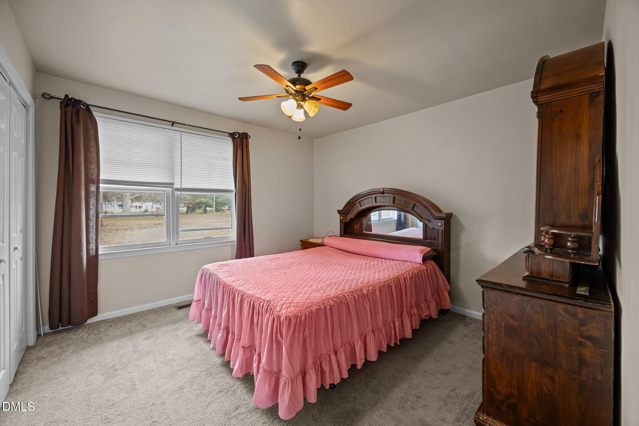 3256 North Old Franklin Road Spring Hope, NC 27882 - Photo 9 of 27 a bedroom with a bed and a window