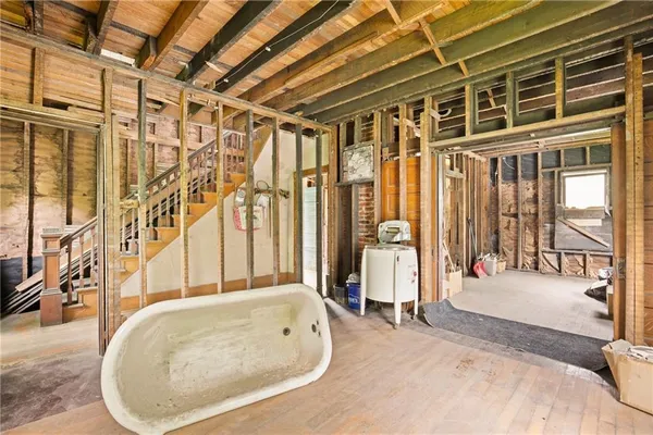 a bathroom with a tub and shower