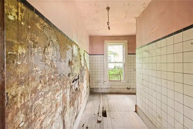 a bathroom with a bathtub and shower
