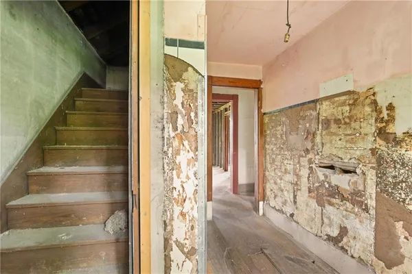 a view of a front door with wooden floor