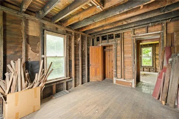 a view of an empty room with a balcony